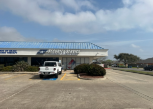 View of the front of the suite from the parking lot facing the sign.